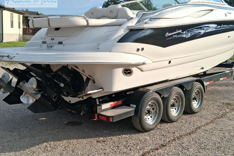 Slide: The Image of 2007 Crownline 320 LS boat on a triple-axle trailer, rear view. - 5