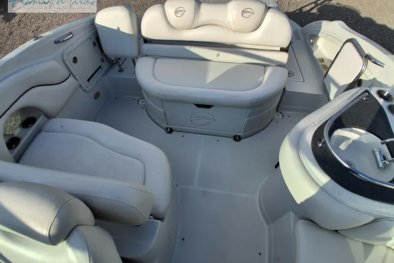 Slide: The Image of 2007 Crownline 320 LS boat interior with white seating and sleek design. - 9