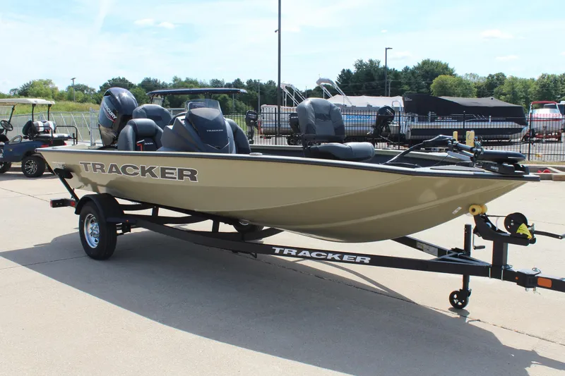 Slide: The Image of 2026 Tracker Pro Team 175 boat on trailer, parked outdoors in a dealership lot. - 3