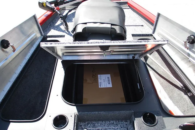 Slide: The Image of 2026 Tracker Pro Team 175 boat storage compartment with open lid and visible interior. - 12