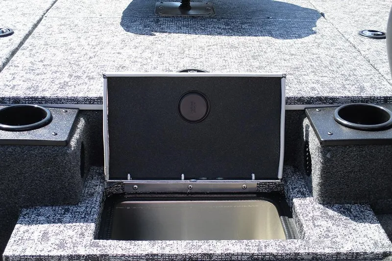 Slide: The Image of 2026 Tracker Pro Team 175 boat interior with open storage compartment and cup holders. - 18