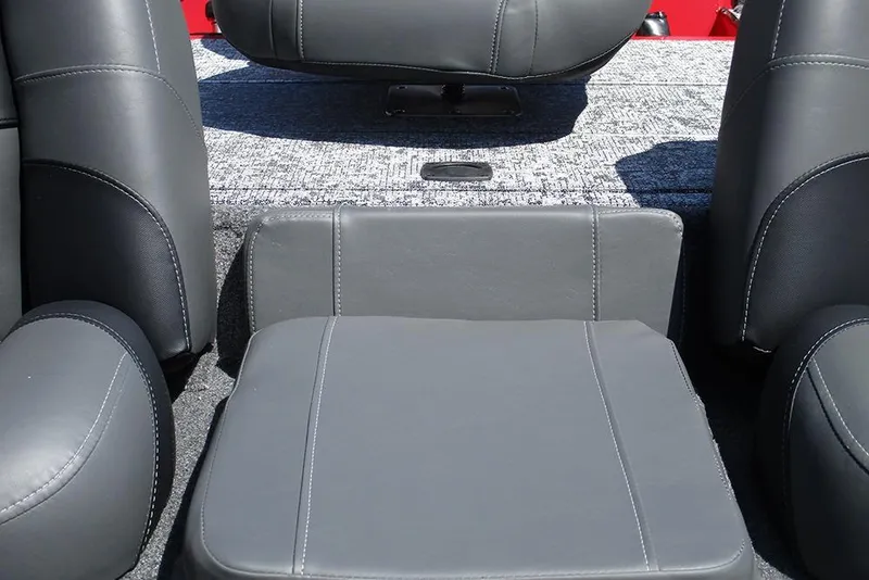 Slide: The Image of 2026 Tracker Pro Team 175 boat interior with gray seating and carpeted flooring. - 21