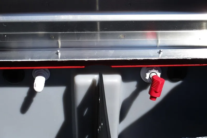 Slide: The Image of 2026 Tracker Pro Team 175 boat interior with red and white valve handles. - 25