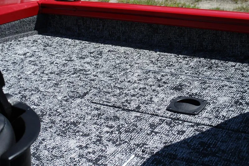 Slide: The Image of 2026 Tracker Pro Team 175 boat deck with textured gray carpeting and red trim. - 27