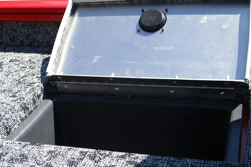 Slide: The Image of Open storage compartment on 2026 Tracker Pro Team 175 boat, featuring a textured interior. - 28