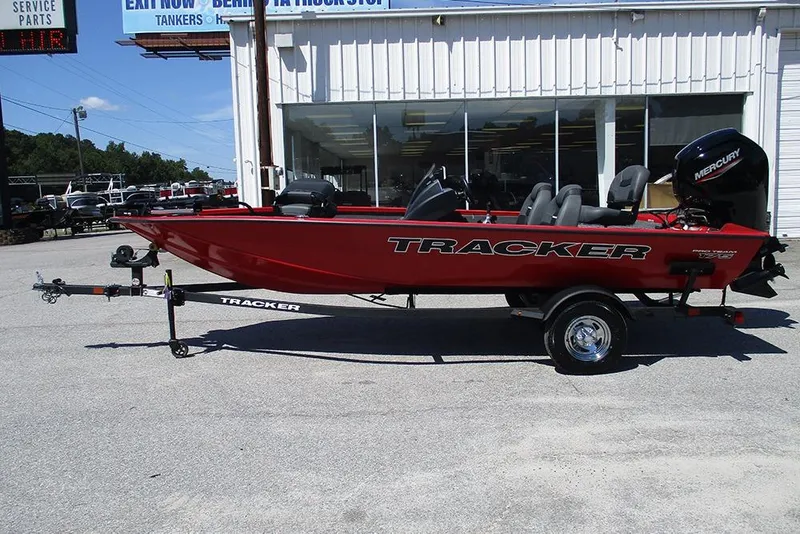 Slide: The Image of 2026 Tracker Pro Team 175 boat in red, parked outside a dealership. - 6