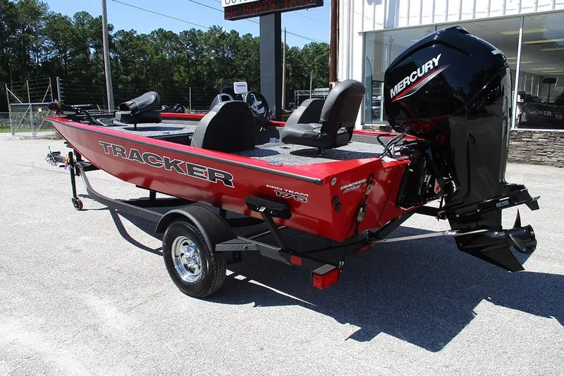 Slide: The Image of 2026 Tracker Pro Team 175 boat with Mercury engine, parked outdoors. - 7