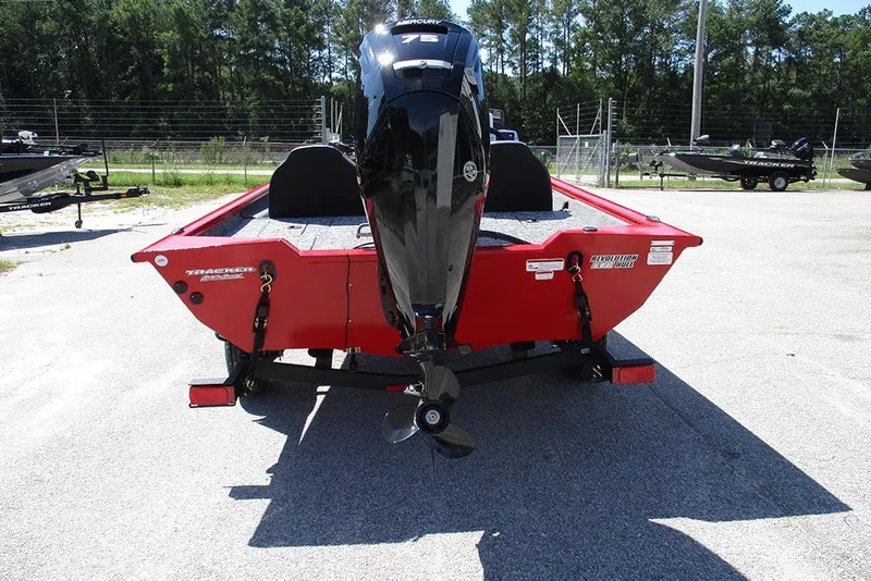 Slide: The Image of 2026 Tracker Pro Team 175 boat, red exterior, rear view with outboard motor. - 8