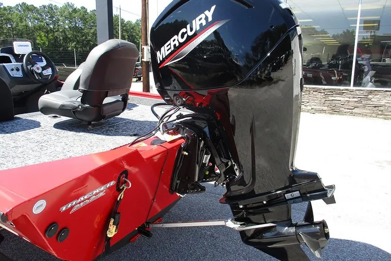 Slide: The Image of 2026 Tracker Pro Team 175 boat with Mercury outboard motor, red and black design. - 9