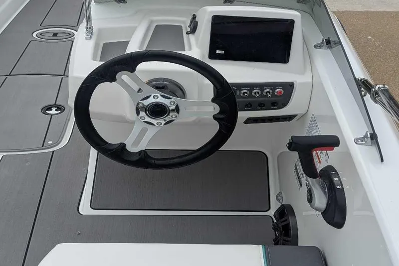 Slide: The Image of 2026 Tahoe T18 boat cockpit with steering wheel and control panel. - 5