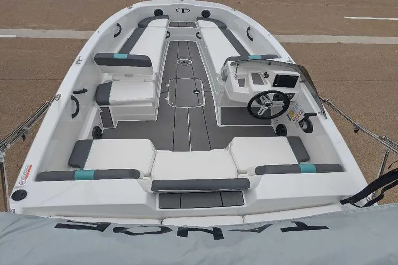Slide: The Image of 2026 Tahoe T18 boat interior with modern seating and steering console. - 6