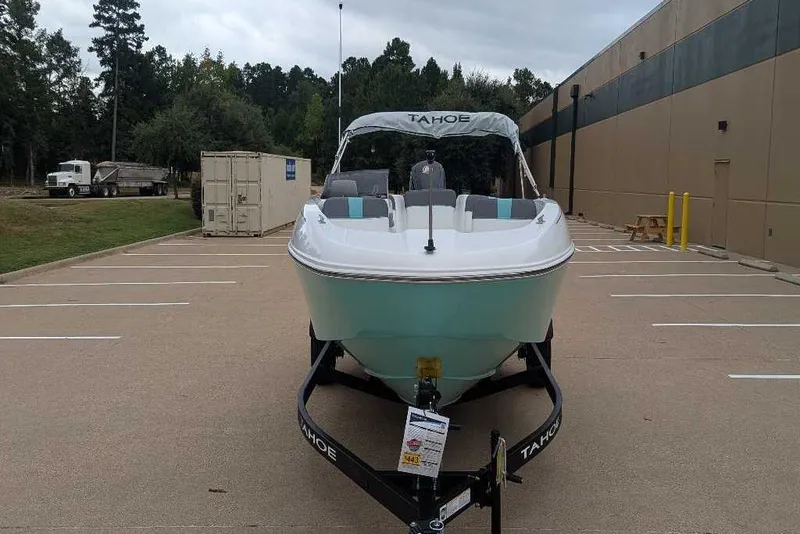Slide: The Image of 2026 Tahoe T18 boat on trailer in parking lot, front view. - 8