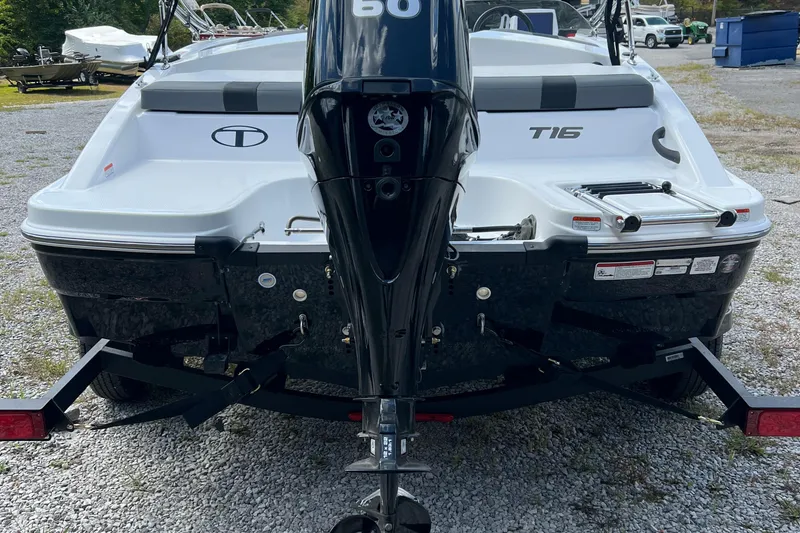 Slide: The Image of 2026 Tahoe T16 boat rear view with outboard motor and trailer. - 5