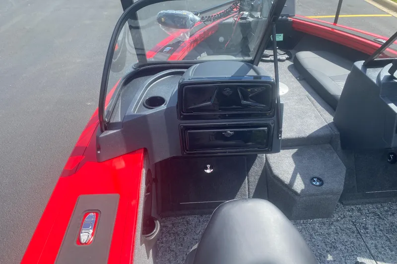 Slide: The Image of 2026 Tracker Targa V-18 Combo boat interior with red accents and seating area. - 6