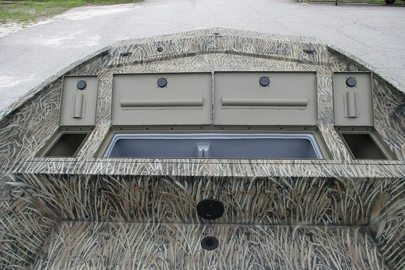 Slide: The Image of 2026 Tracker Grizzly 2072 CC boat with camo design and storage compartments. - 13