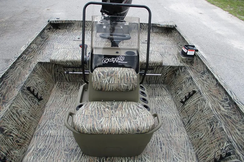 Slide: The Image of 2026 Tracker Grizzly 2072 CC boat with camouflage interior and central console. - 17