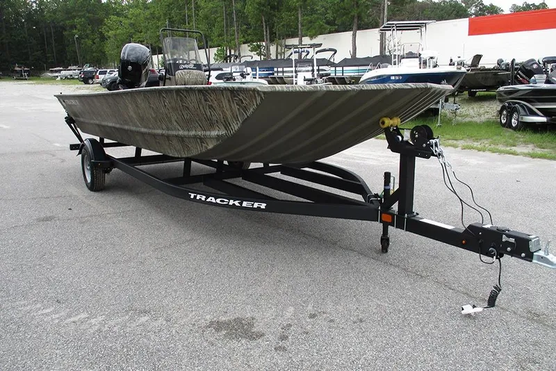 Slide: The Image of 2026 Tracker Grizzly 2072 CC boat on trailer in outdoor setting. - 3