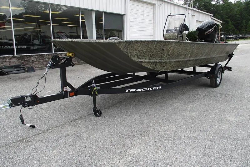 Slide: The Image of 2026 Tracker Grizzly 2072 CC boat on trailer, parked outside dealership. - 5