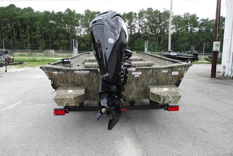 Slide: The Image of 2026 Tracker Grizzly 2072 CC boat with camouflage design and powerful outboard motor. - 8