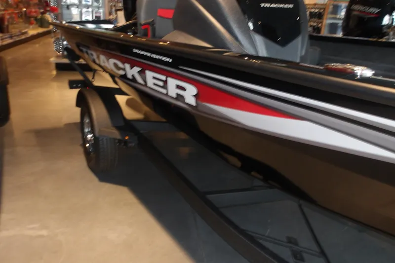 Slide: The Image of 2026 Tracker Pro Team 175 Crappie Edition boat on display in showroom. - 5