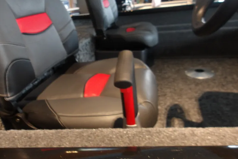 Slide: The Image of Interior of 2026 Tracker Pro Team 175 Crappie Edition boat with red-accented seats. - 7