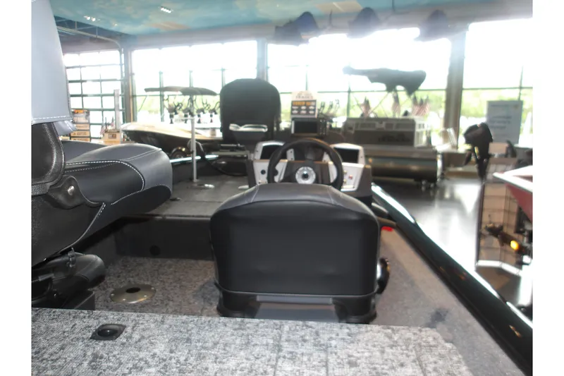 Slide: The Image of 2026 Tracker Pro Team 175 Crappie Edition boat interior with steering console. - 8