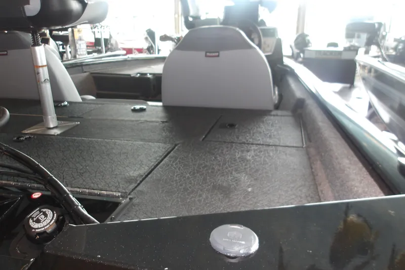 Slide: The Image of 2026 Tracker Pro Team 175 Crappie Edition boat interior with seating and storage compartments. - 22