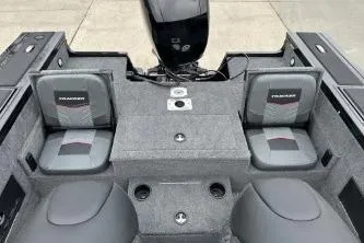 Slide: The Image of 2026 Tracker Targa V-18 Combo boat interior with seating and motor. - 10