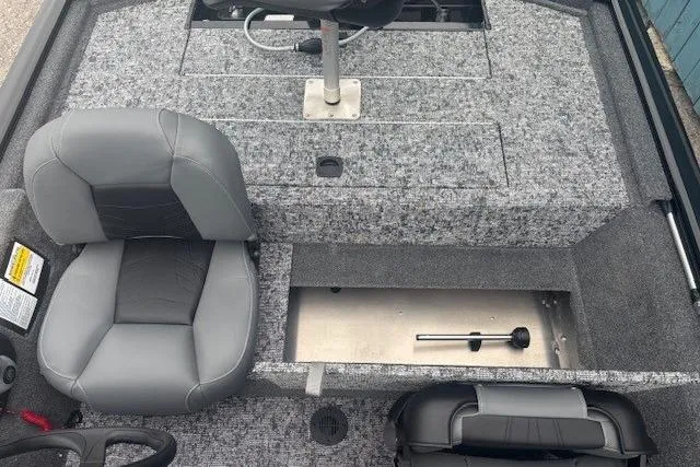 Slide: The Image of 2026 Tracker Pro 170 boat interior with gray seating and storage compartments. - 12