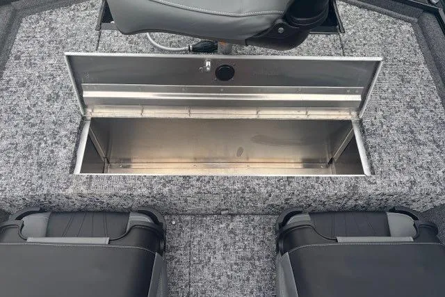 Slide: The Image of 2026 Tracker Pro 170 boat interior with open storage compartment and seating. - 13