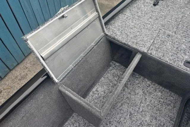 Slide: The Image of 2026 Tracker Pro 170 boat storage compartment with open lid, showcasing interior space. - 8