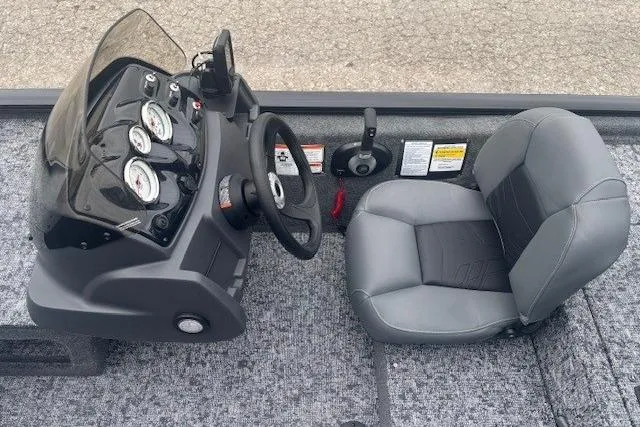 Slide: The Image of 2026 Tracker Pro 170 boat interior with steering wheel and gauges. - 9