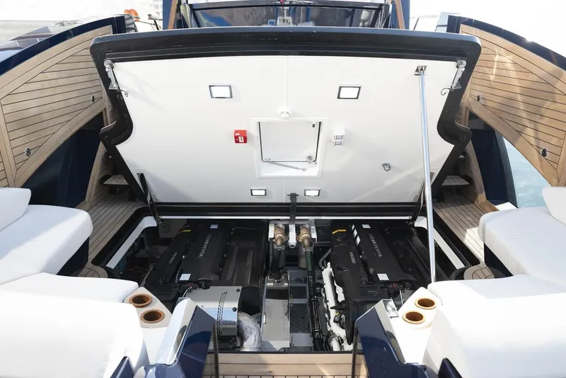 Slide: The Image of 2023 Lazzara LSX 67 yacht engine compartment with open hatch, showcasing modern design. - 11
