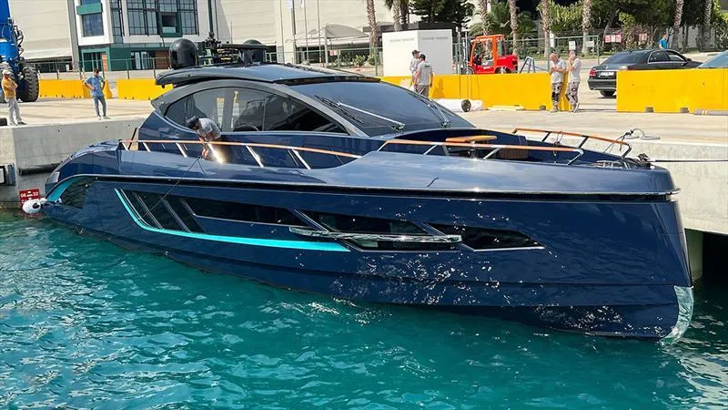 Slide: The Image of 2023 Lazzara LSX 67 luxury yacht docked in clear blue water. - 3