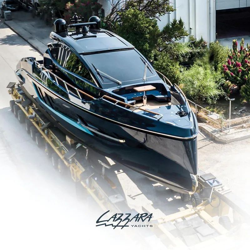 Slide: The Image of 2023 Lazzara LSX 67 yacht on transport, sleek design, luxury vessel. - 4