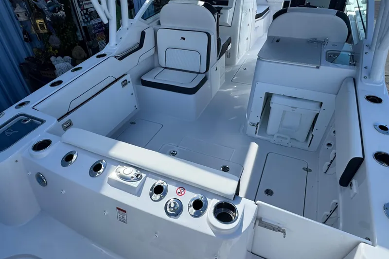 Slide: The Image of 2026 Stingray 259 DC boat interior, featuring sleek seating and modern amenities. - 3