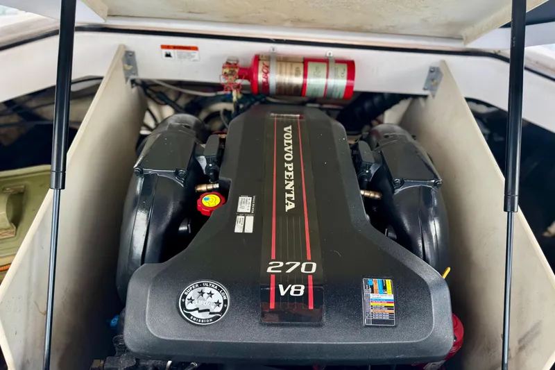 Slide: The Image of Volvo Penta 270 V8 engine in 2013 Regal 21 OBX boat, with fire extinguisher. - 10