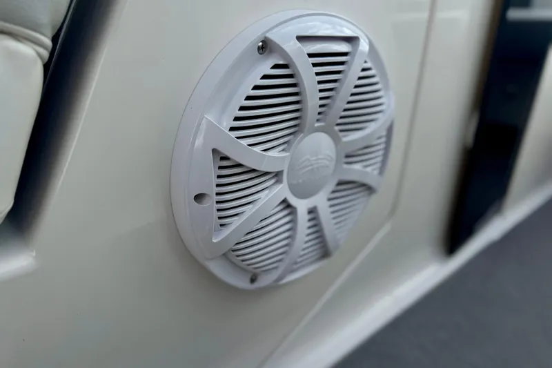 Slide: The Image of Close-up of a speaker on a 2013 Regal 21 OBX boat interior. - 13