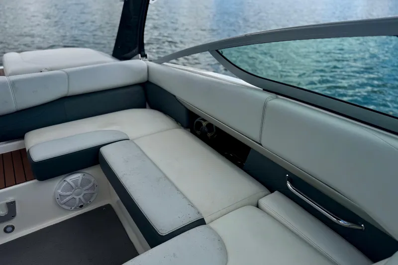 Slide: The Image of Interior seating of 2013 Regal 21 OBX boat with water view. - 15