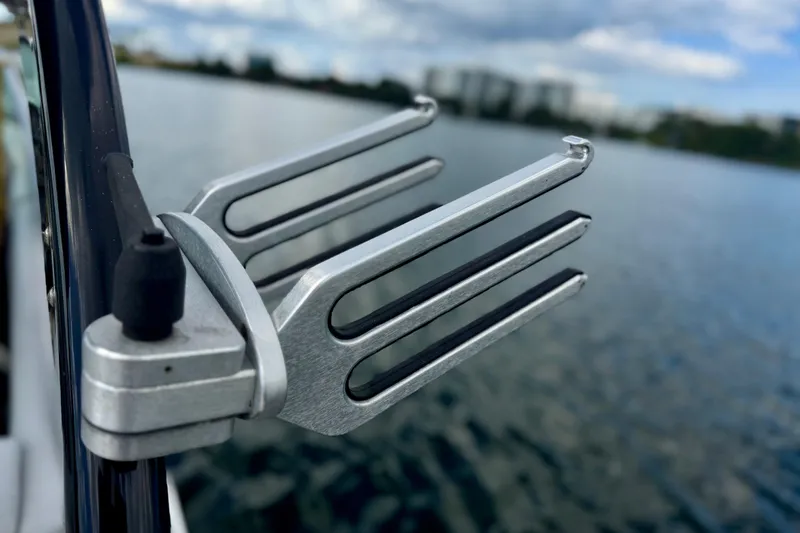 Slide: The Image of Close-up of a 2013 Regal 21 OBX boat accessory against a lake backdrop. - 19