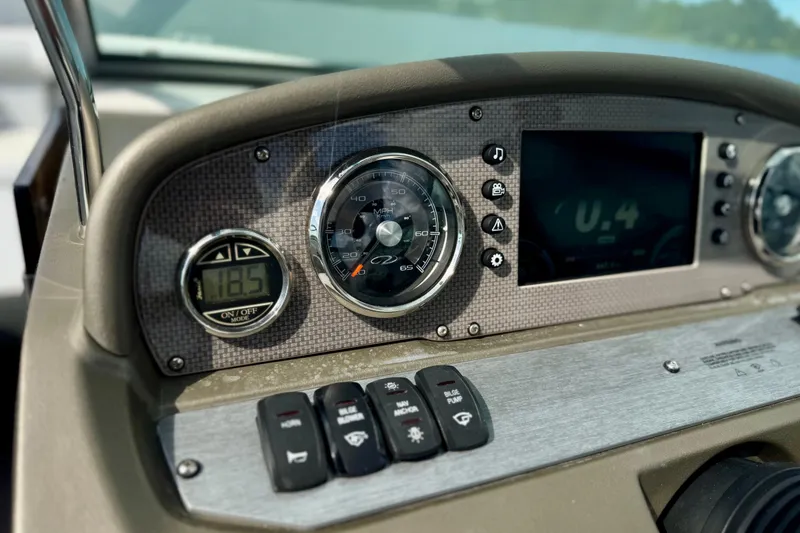 Slide: The Image of Dashboard of 2013 Regal 21 OBX boat with speedometer and digital display. - 5