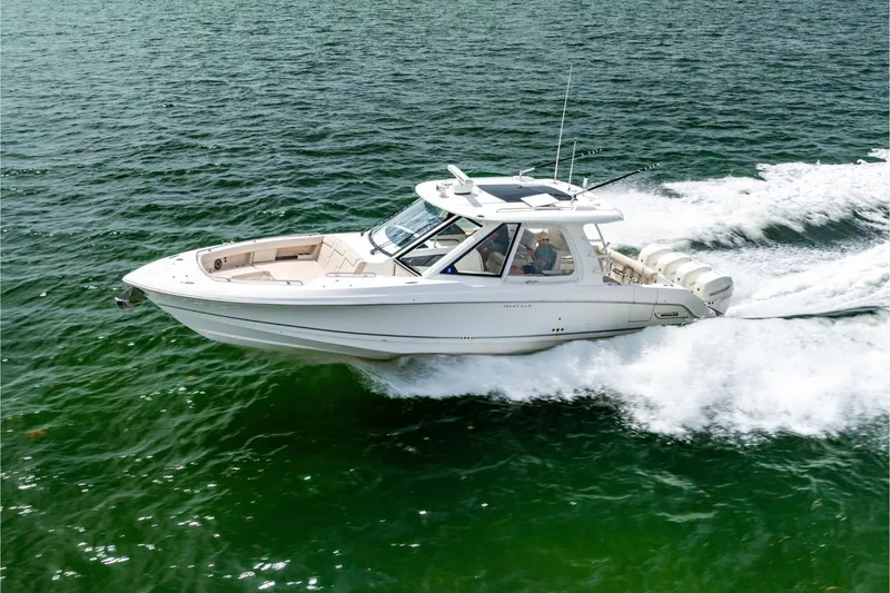 The Image of 2019 Boston Whaler 380 Realm cruising on open water, showcasing sleek design and performance. - 0