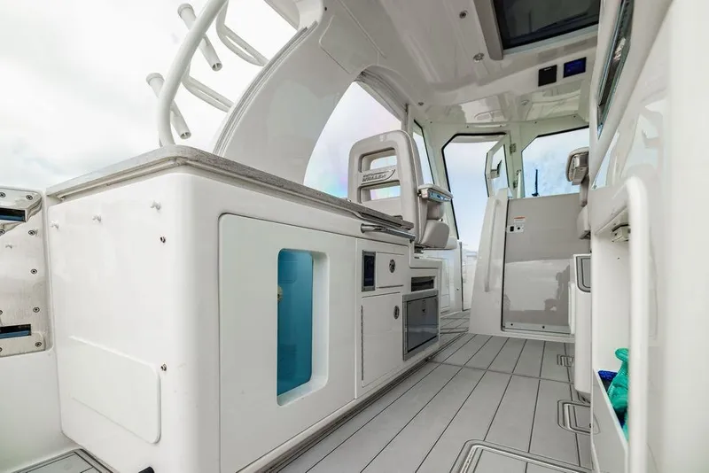 Slide: The Image of Interior of 2019 Boston Whaler 380 Realm boat, featuring sleek design and modern amenities. - 13