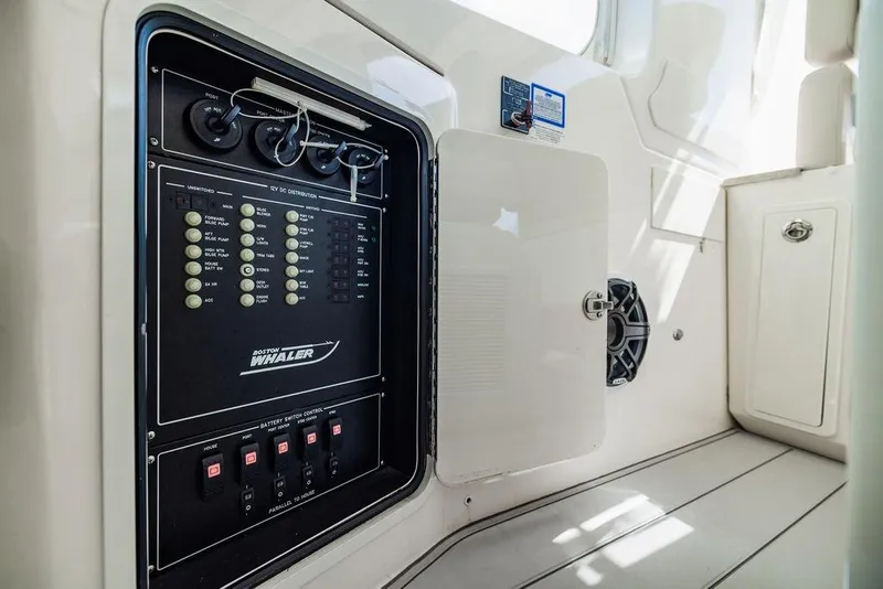 Slide: The Image of 2019 Boston Whaler 380 Realm electrical panel and interior details. - 20
