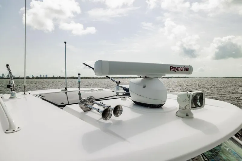 Slide: The Image of 2019 Boston Whaler 380 Realm boat with Raymarine radar on open water. - 25