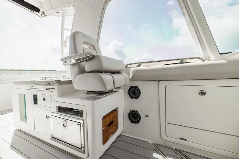 Slide: The Image of 2019 Boston Whaler 380 Realm interior with luxurious seating and storage compartments. - 26