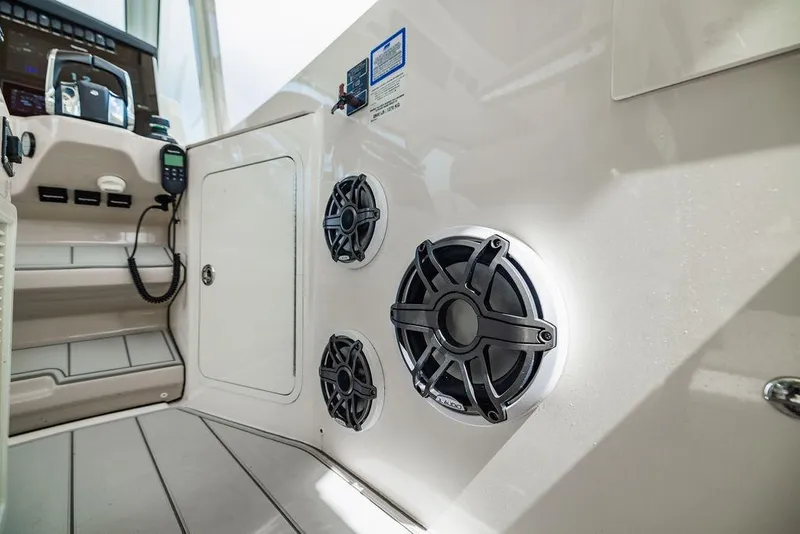 Slide: The Image of Interior view of 2019 Boston Whaler 380 Realm, featuring speakers and control panel. - 27