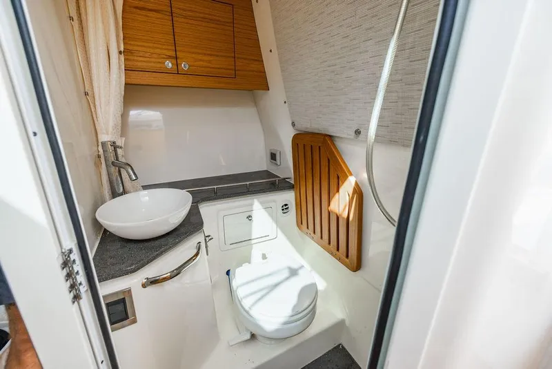 Slide: The Image of 2019 Boston Whaler 380 Realm boat bathroom with modern sink and toilet. - 33