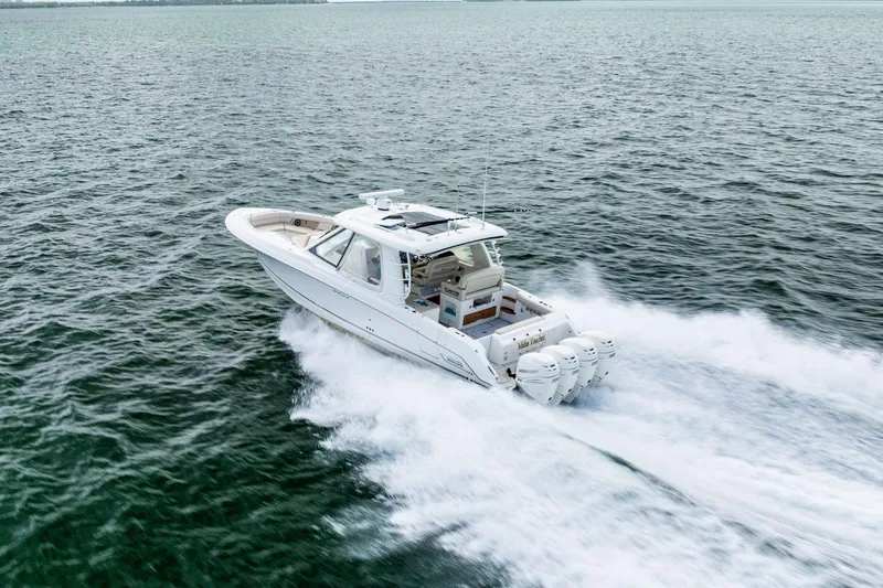 Slide: The Image of 2019 Boston Whaler 380 Realm cruising on open water, showcasing powerful engines. - 35