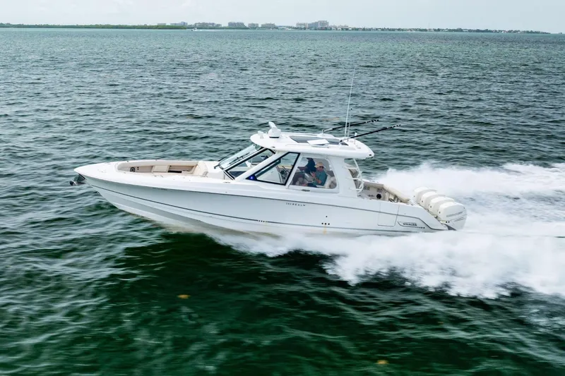 Slide: The Image of 2019 Boston Whaler 380 Realm cruising swiftly on open water. - 36